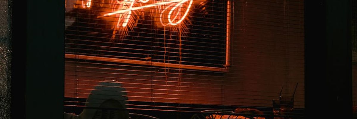 Atmospheric dimly lit workspace with neon accents